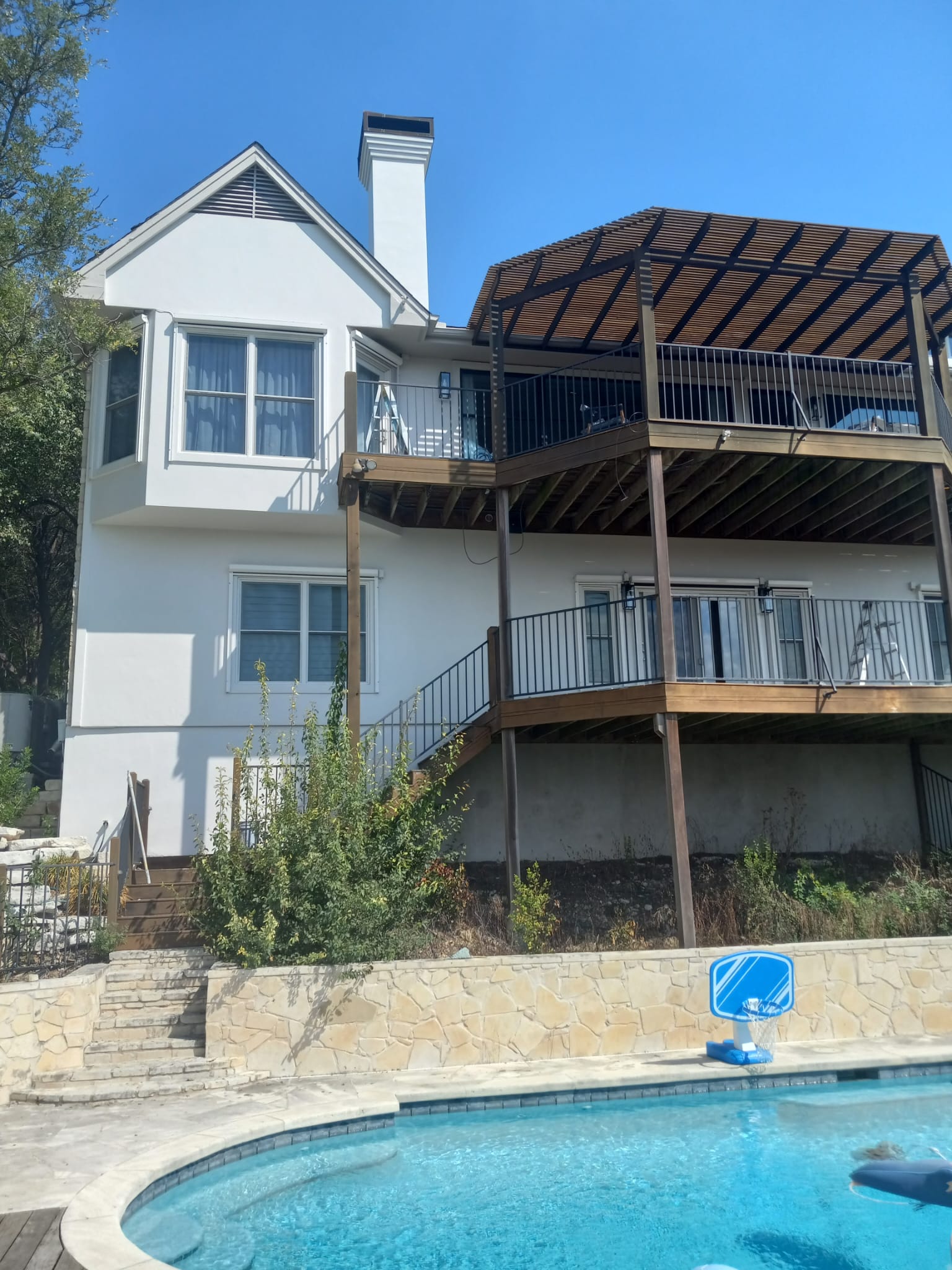 Hillside home with decks repainted in Austin