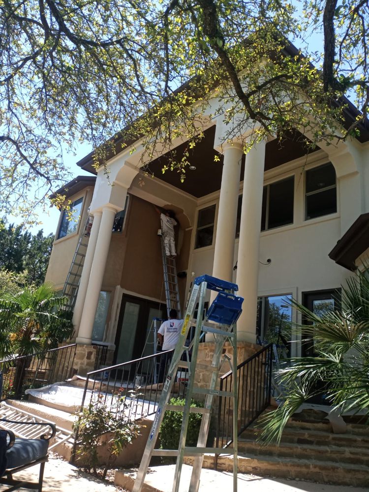 APP crew painting exterior stucco and columns