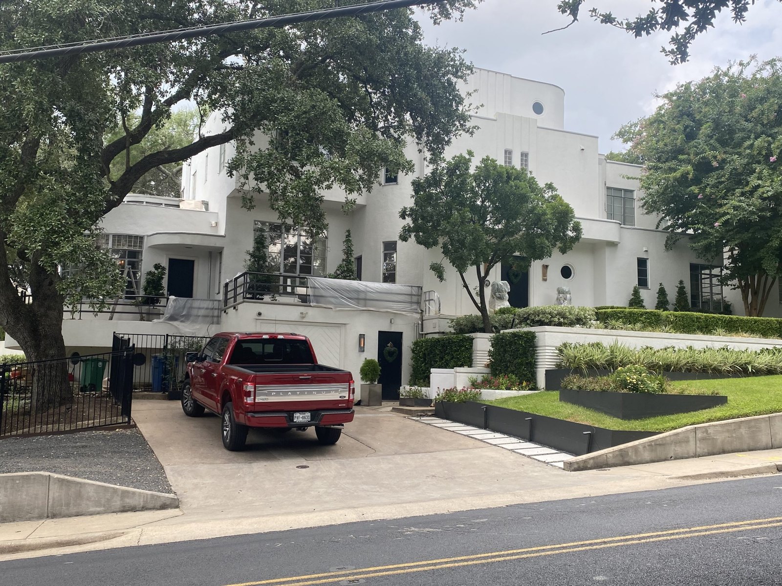 White modern townhomes repainted in Austin