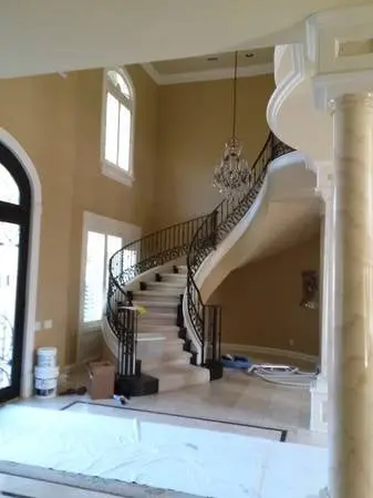 Painted foyer and curved staircase in an Austin home