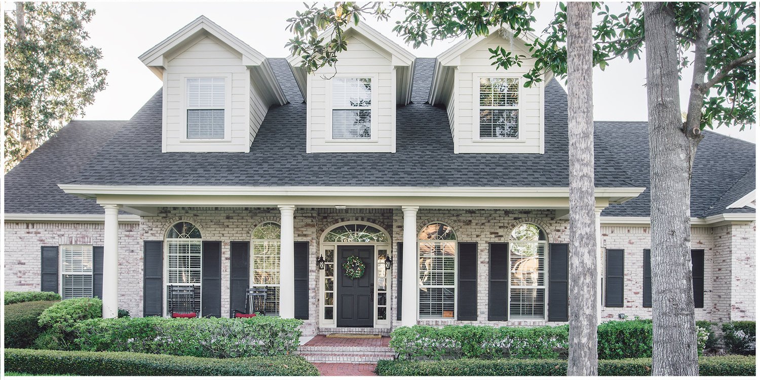 Colonial brick home in Austin after limewash
