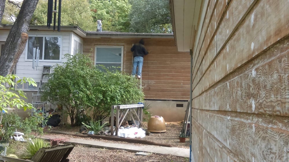 Stripping and sanding original siding on an Austin restoration