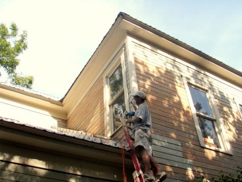 Stripping failed coating from historic siding in Austin